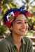 Haiti flag bandana worn as headwrap outdoors