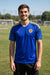 Blue and yellow trim jersey worn outdoors