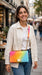 Rainbow quilted purse worn crossbody outdoors