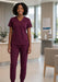 Wine scrub set worn by a healthcare worker